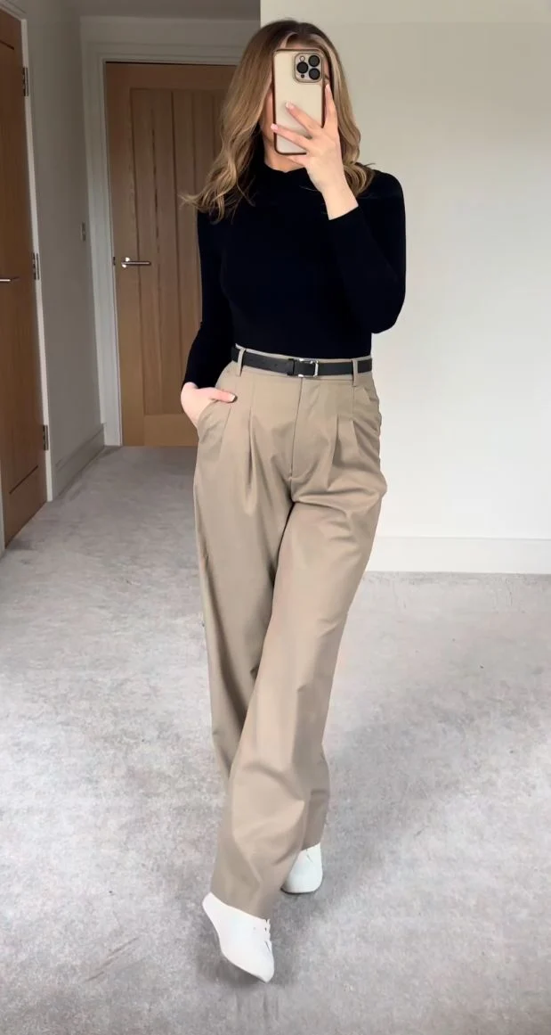 Fall office outfit idea with black turtleneck and khaki loose suit pants