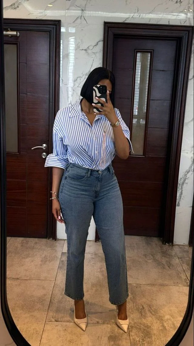 Woman in striped shirt & straight jeans